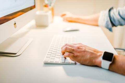 Photo of man using computer